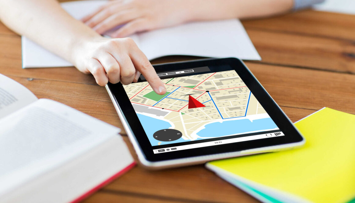 close up of student with tablet pc and notebook
