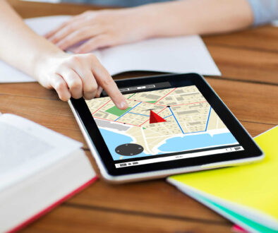 close up of student with tablet pc and notebook