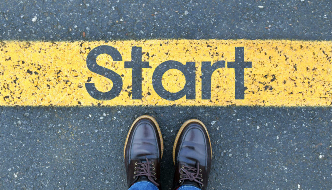 low-section-person-standing-by-text-road