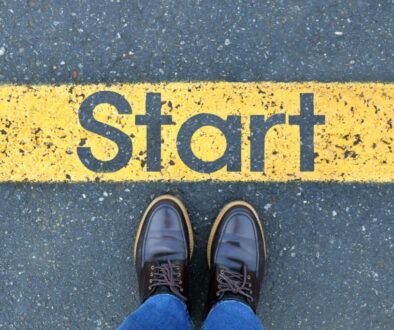 low-section-person-standing-by-text-road