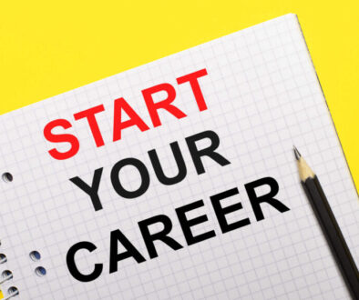 White notebook with inscription START YOUR CAREER written in black pencil on a bright yellow background.