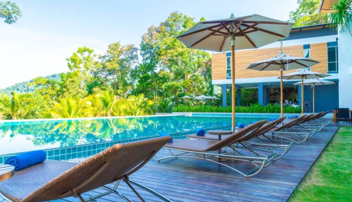 beautiful-umbrella-chair-around-swimming-pool-hotel-resort_0x800