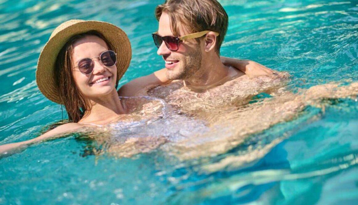 good-moments-young-happy-couple-spending-time-swimming-pool(1)_0x800