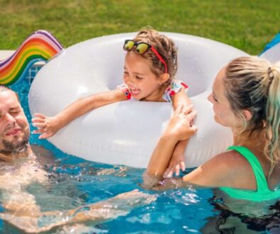happy-parents-their-daughter-rubber-ring-are-swimming-pool_0x800