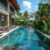 modern-resort-swimming-pool-area-with-crystalclear-water-comfortable-lounge-chairs-set-against-scenic-backdrop_0x800