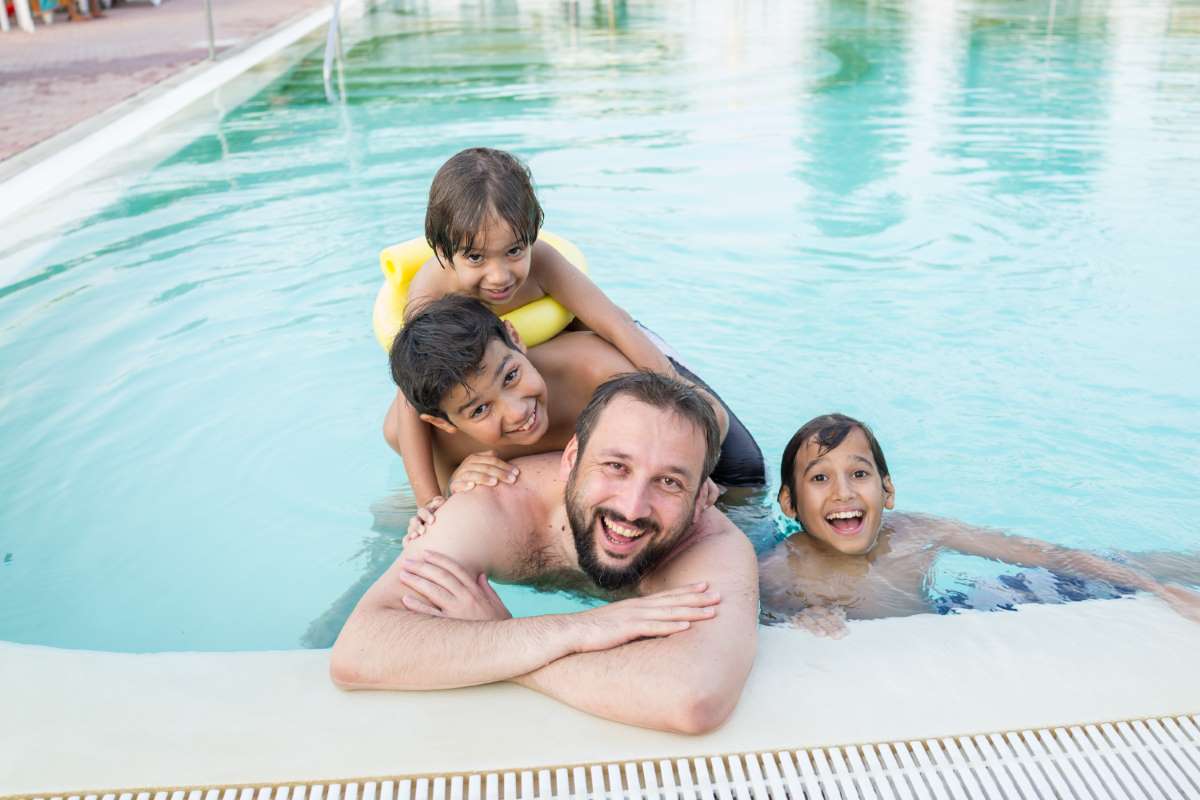 young-boy-kid-child-splashing-swimming-pool-having-fun-leisure-activity_0x800