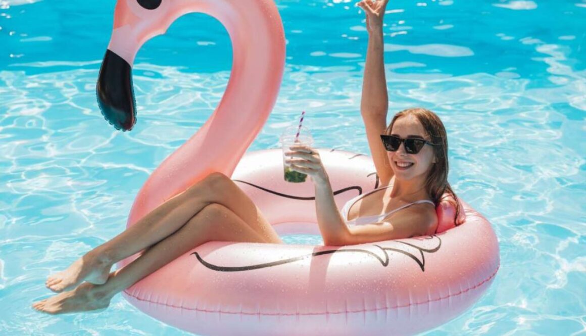 young-woman-relaxing-flamingo-swim-ring_0x800