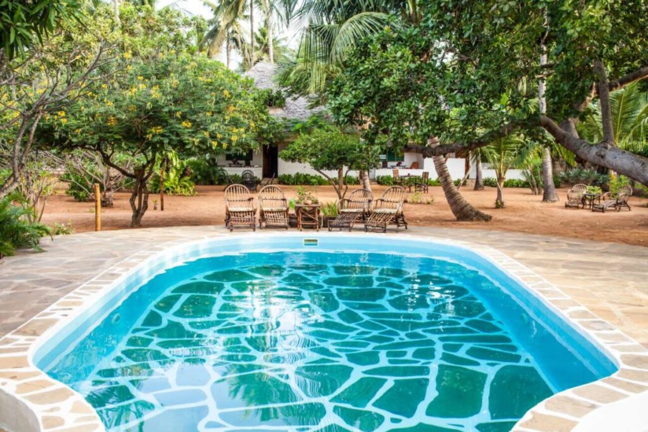 kenya-luxury-swimming-pool-african-garden-with-tipical-local-chairs-made-wood-background_0x800