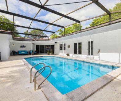 backyard-modern-house-with-swimming-pool-artificial-grass-stone-path-trees-chairs_0x800