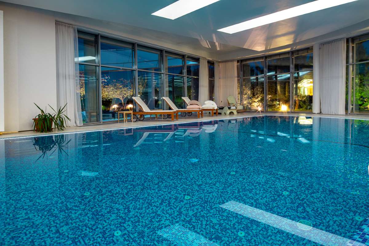 indoor-pool-private-villa-overlooking-evening-park-windows_0x800