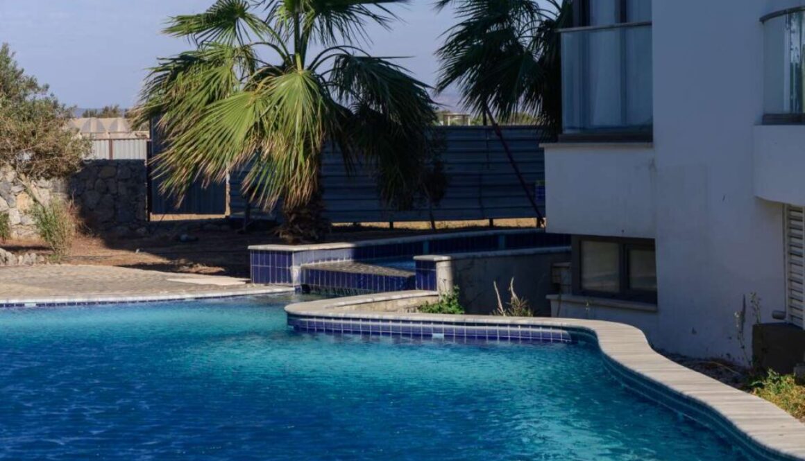 relaxing-afternoon-by-tranquil-poolside-surrounded-by-palm-trees-sunny-day_0x800