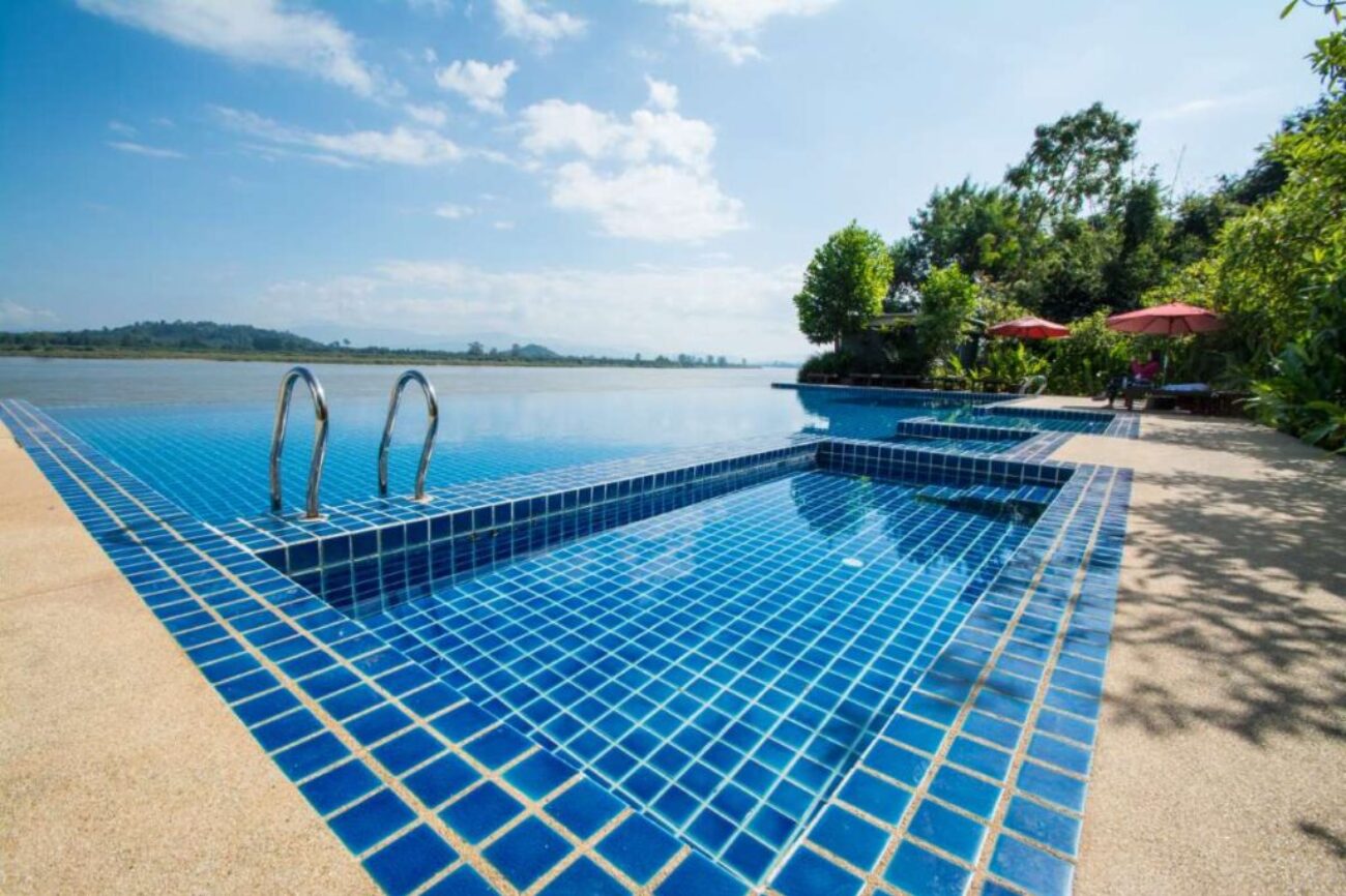 swimming-pool-near-khong-river-with-blue-sky-chiangsan-chiangrai-thailand_0x800